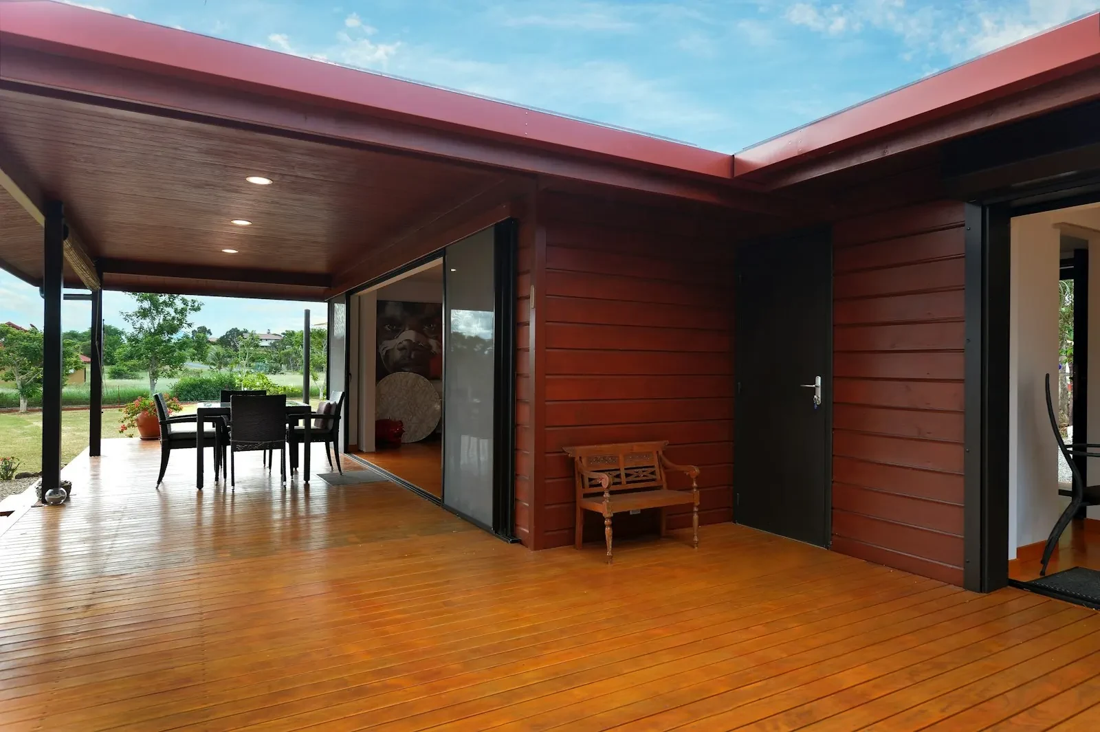Wide patio opening beside a timber deck